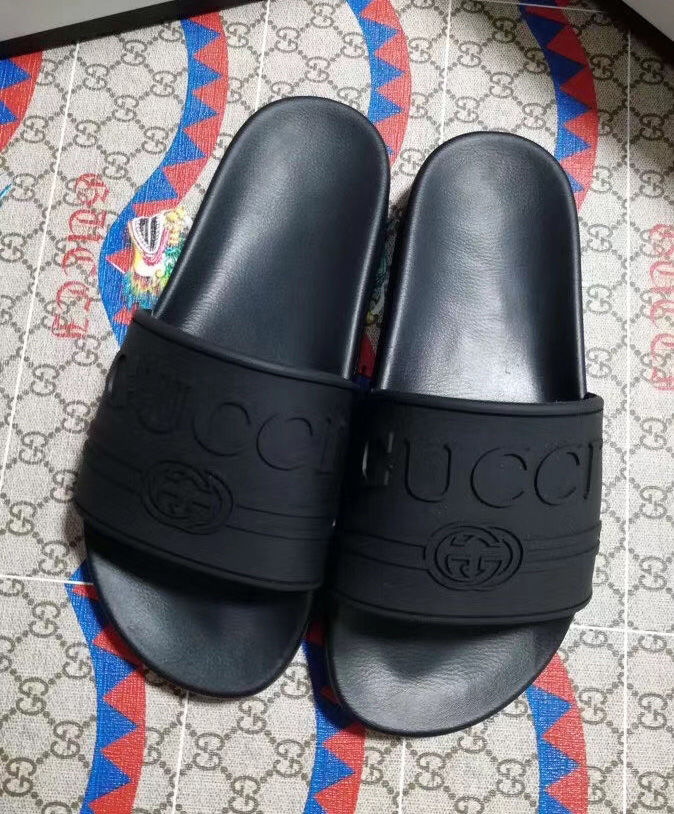 Gucci Unisex Gucci logo rubber slide sandal Black