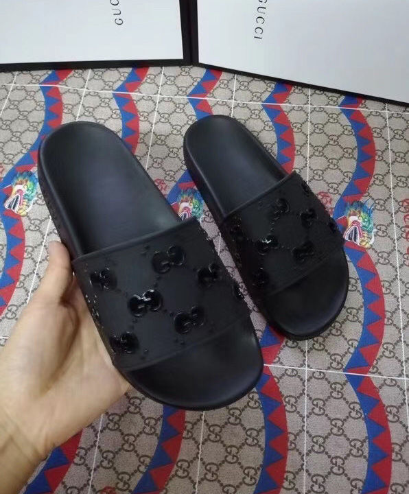 Gucci Unisex rubber GG slide sandal Black - AlimorLuxury