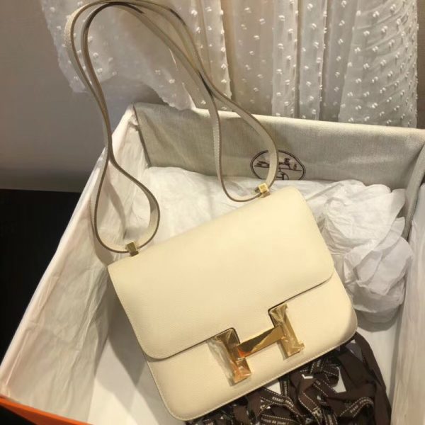 Hermes White Atoll Epsom Constance 24cm Color: White Size: 24cm x 15cm x 5 cm Hardware: Golden Buckle Leather: Epsom calf Leather Pockets: zip pocket with a Hermes engraved pull Accompanied by: Hermes box, Hermes dustbag, ribbon, and care book