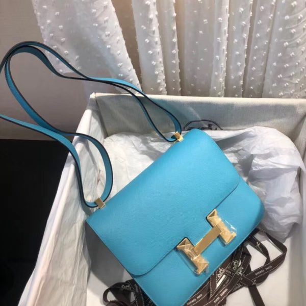Hermes Blue Atoll Epsom Constance 24cm Color: Blue Size: 24cm x 15cm x 5 cm Hardware: Golden Buckle Leather: Epsom calf Leather Pockets: zip pocket with a Hermes engraved pull Accompanied by: Hermes box, Hermes dustbag, ribbon, and care book