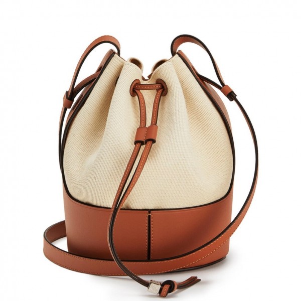 Loewe's Balloon bucket bag is a brand new style for Spring '20. This small version has been made in the label's historic Madrid workshop from cotton-canvas and tan leather. The base is debossed with the house's recognizable swirling logo, too.